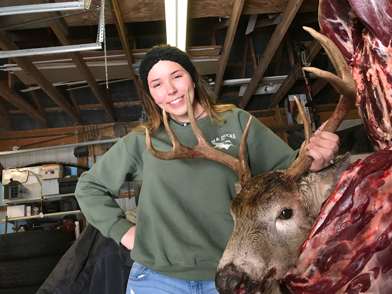 Woman with giant buck